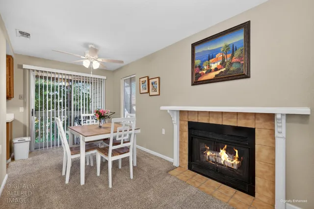 a view of a livingroom with furniture and a fireplace