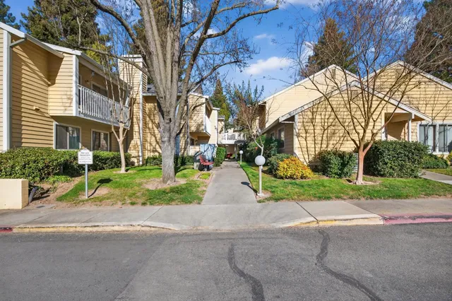 a view of a street with a building in the background