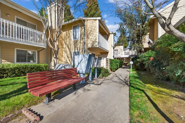 a front view of a house with a yard table and chairs