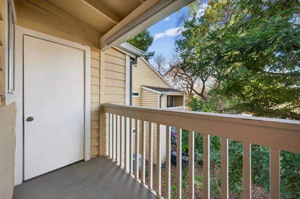 a porch with a table in balcony