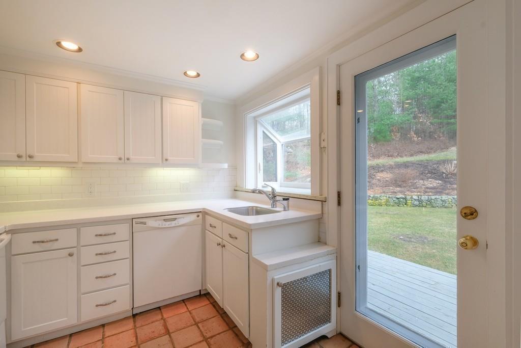 53 Moore Road Wayland, MA 01778 - Photo 14 of 27 a kitchen with white cabinets and a sink