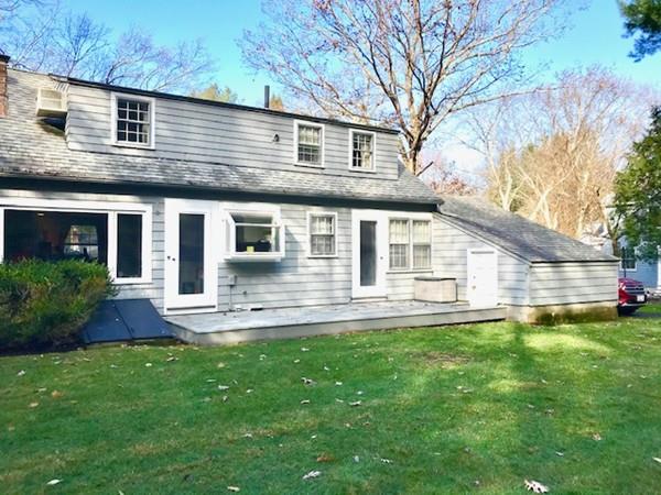 53 Moore Road Wayland, MA 01778 - Photo 27 of 27 a front view of a house with a yard and garage
