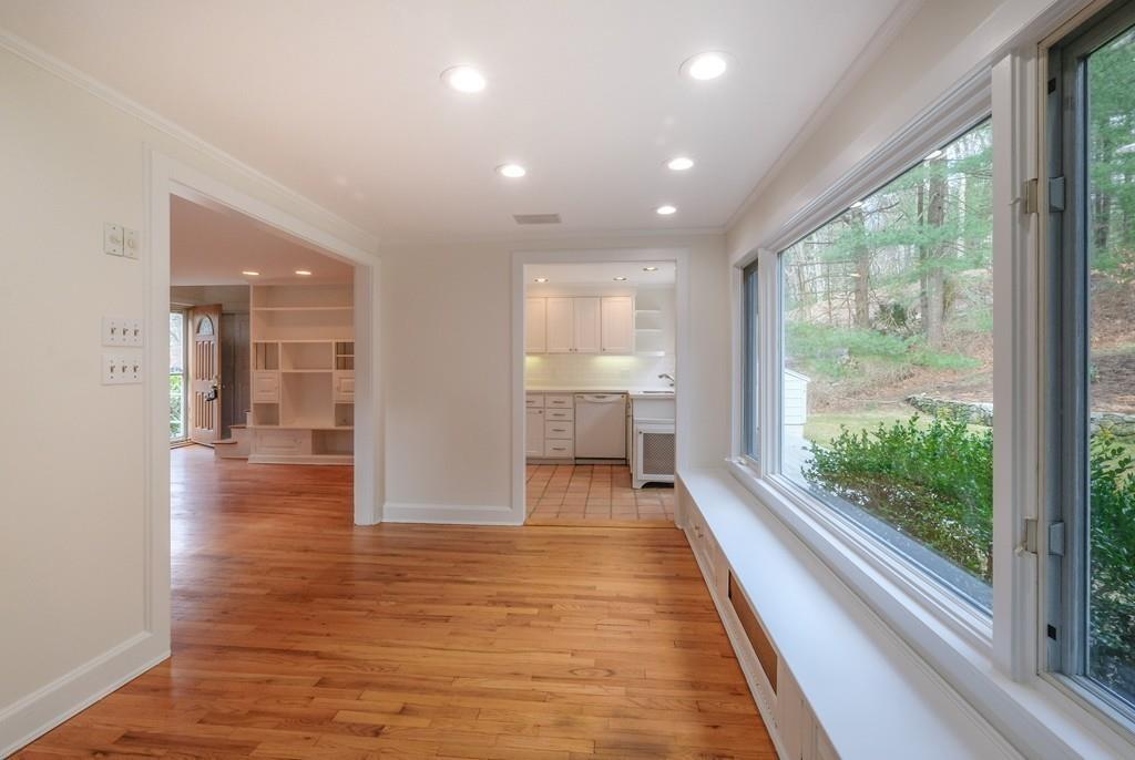 53 Moore Road Wayland, MA 01778 - Photo 6 of 27 a view of hallway with a large window and wooden floor