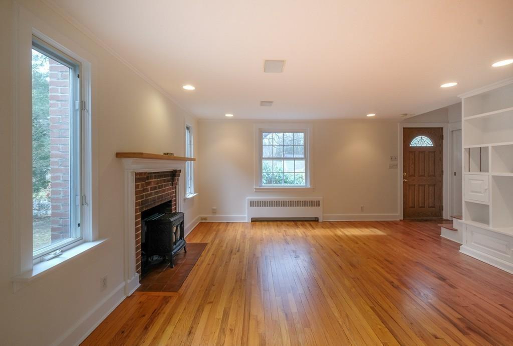 53 Moore Road Wayland, MA 01778 - Photo 9 of 27 a view of an empty room with a window and wooden floor