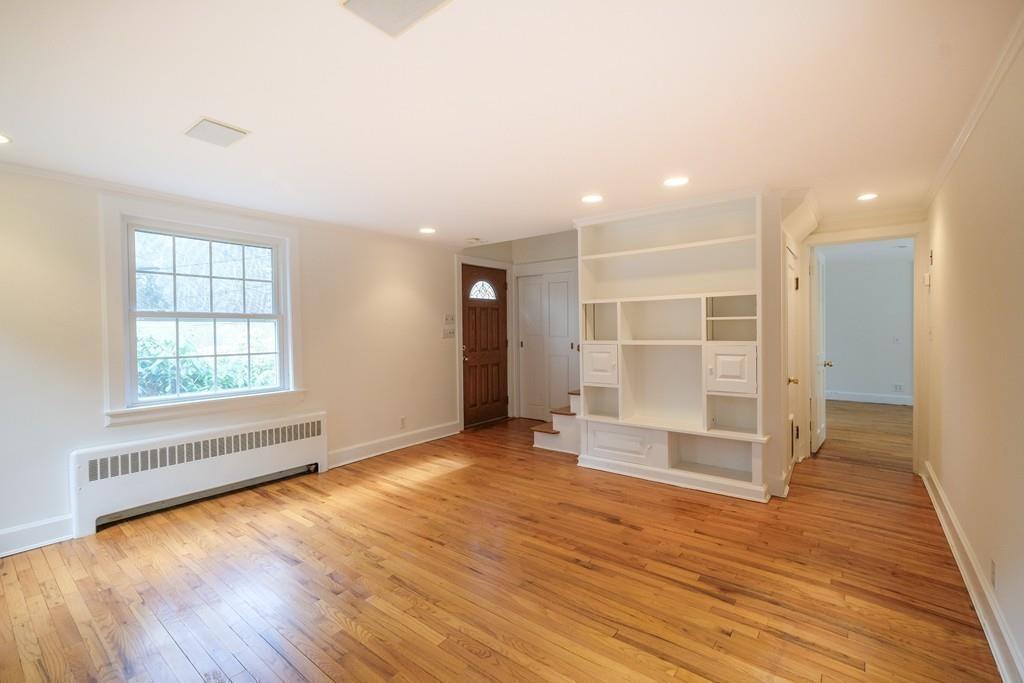 53 Moore Road Wayland, MA 01778 - Photo 10 of 27 an empty room with wooden floor and windows