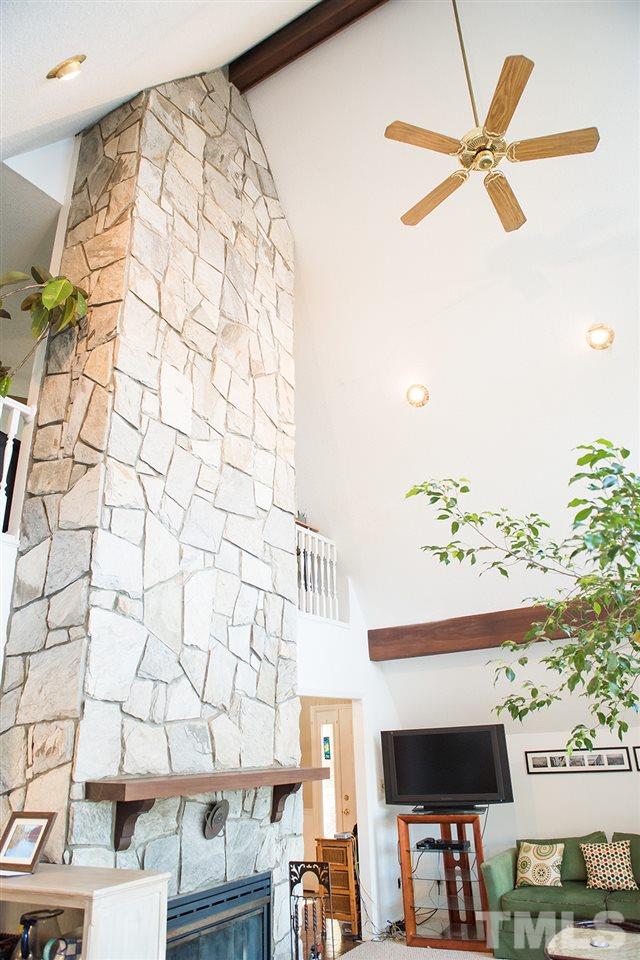 313 Fishermans Point Road Roxboro, NC 27574 - Photo 15 of 25 a fan room with a bed and a chandelier