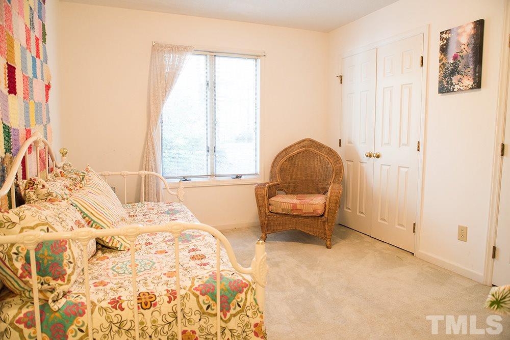 313 Fishermans Point Road Roxboro, NC 27574 - Photo 16 of 25 a bedroom with a bed and a chair