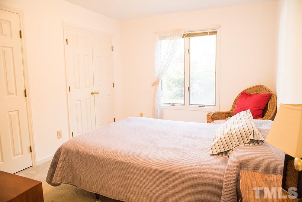 313 Fishermans Point Road Roxboro, NC 27574 - Photo 18 of 25 a bedroom with a bed and a window