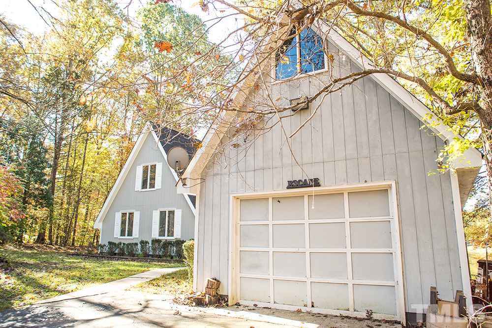 313 Fishermans Point Road Roxboro, NC 27574 - Photo 25 of 25 a view of a house with a yard