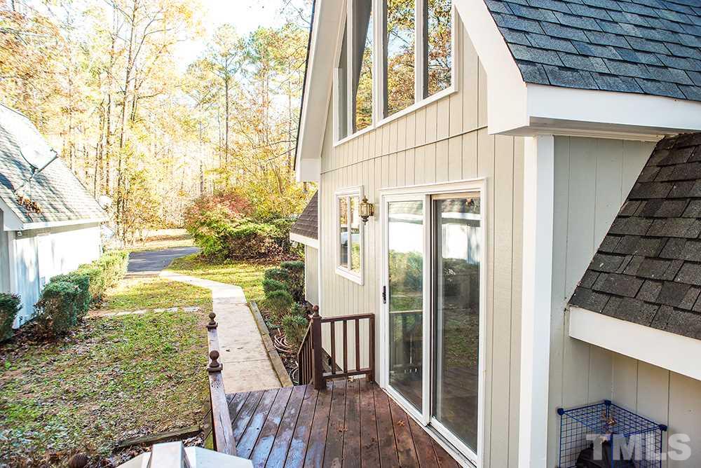 313 Fishermans Point Road Roxboro, NC 27574 - Photo 4 of 25 a view of balcony with two chairs and wooden fence