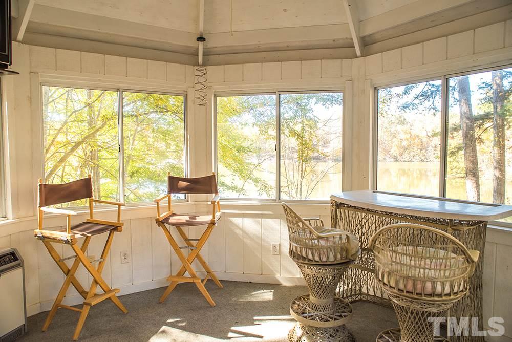 313 Fishermans Point Road Roxboro, NC 27574 - Photo 6 of 25 a view of a dining room with furniture window and outside view