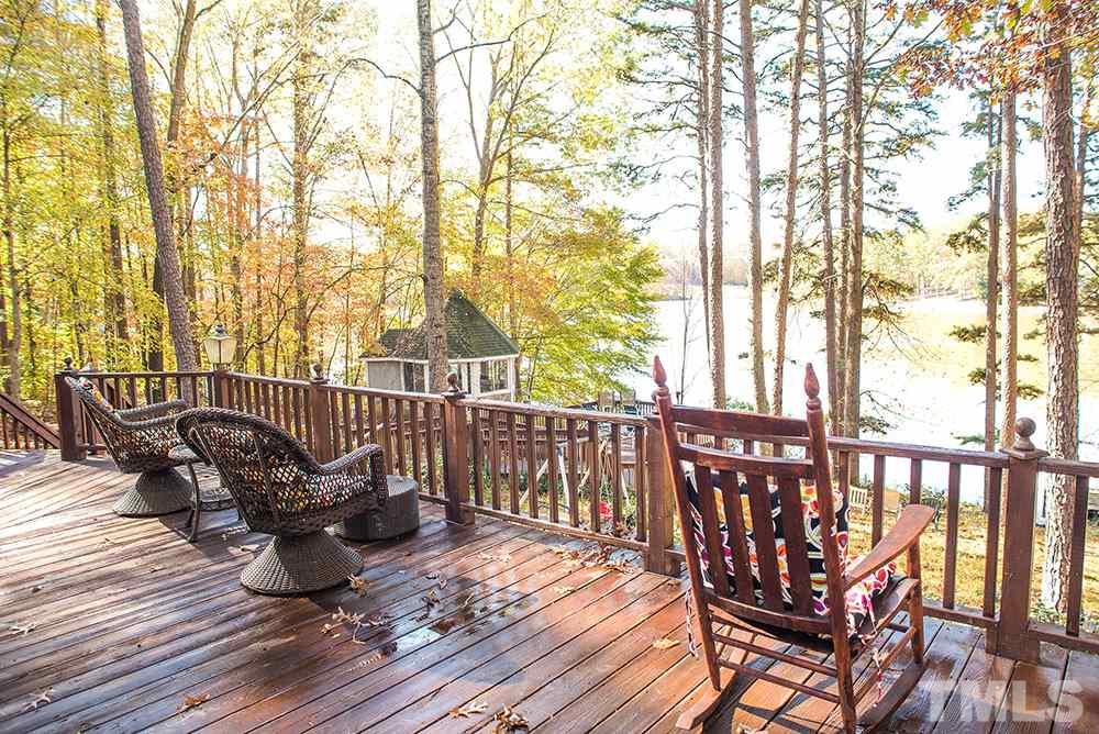 313 Fishermans Point Road Roxboro, NC 27574 - Photo 10 of 25 a view of balcony with wooden floor and outdoor seating