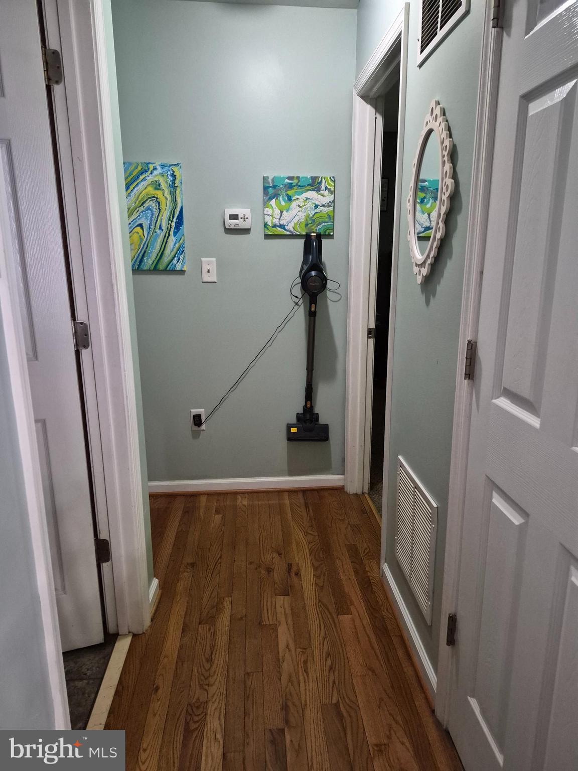 1440 Drummer Hill Road Front Royal, VA 22630 - Photo 25 of 42 a view of a hallway with wooden floor and staircase