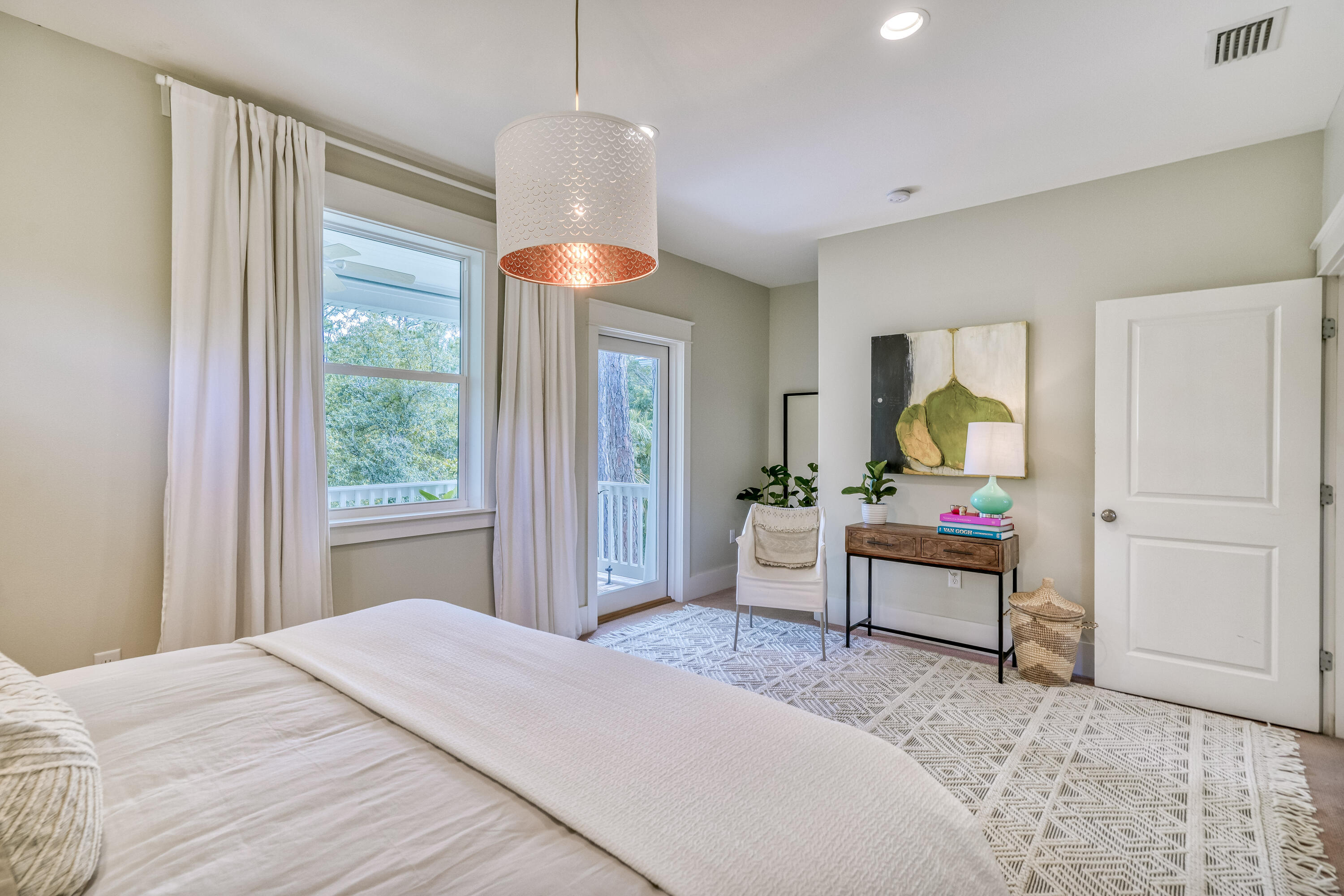 100 Snapper Street Santa Rosa Beach, FL 32459 - Photo 12 of 35 a bedroom with a bed and a chandelier