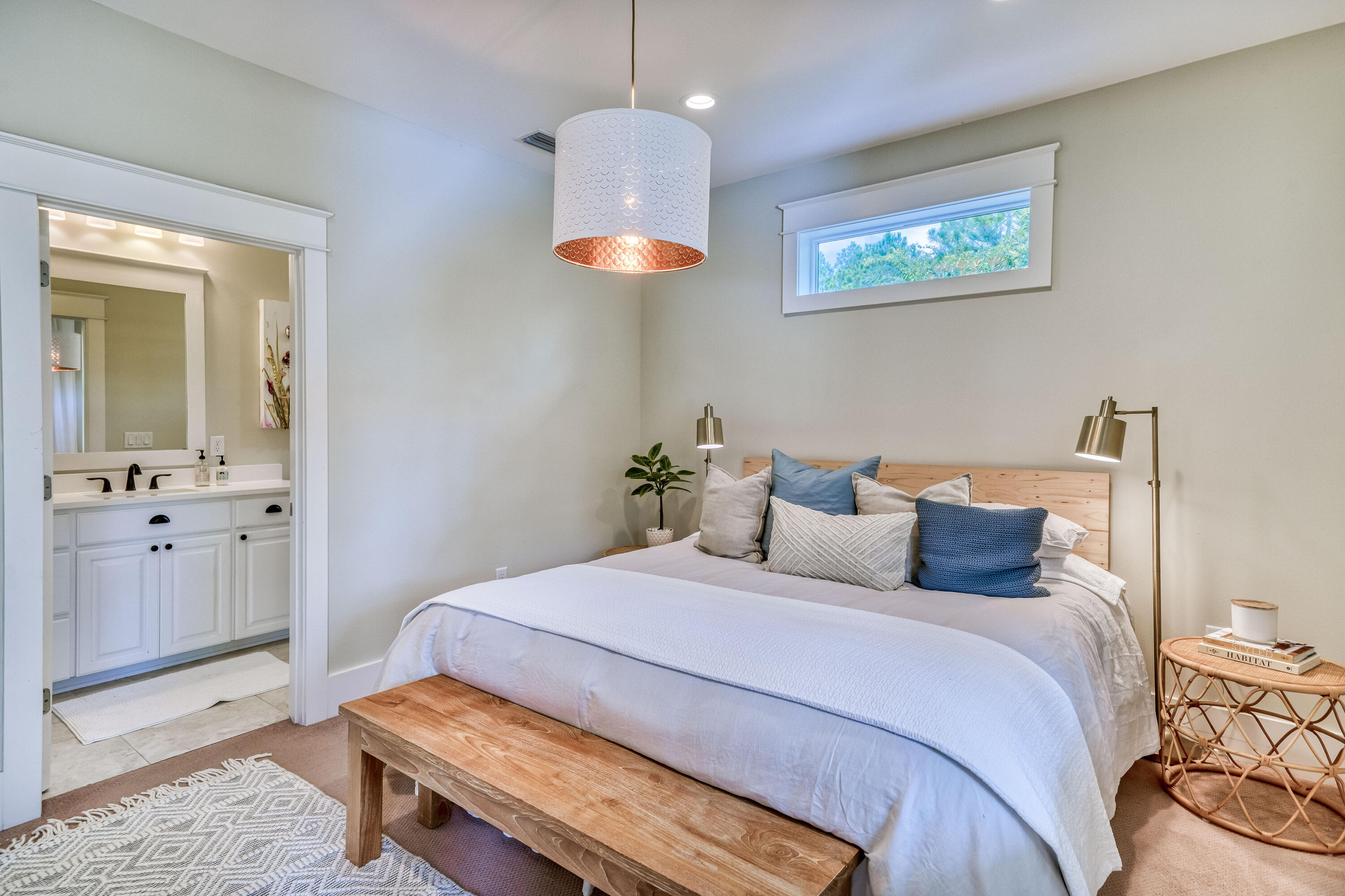 100 Snapper Street Santa Rosa Beach, FL 32459 - Photo 13 of 35 a bedroom with a bed and a chandelier