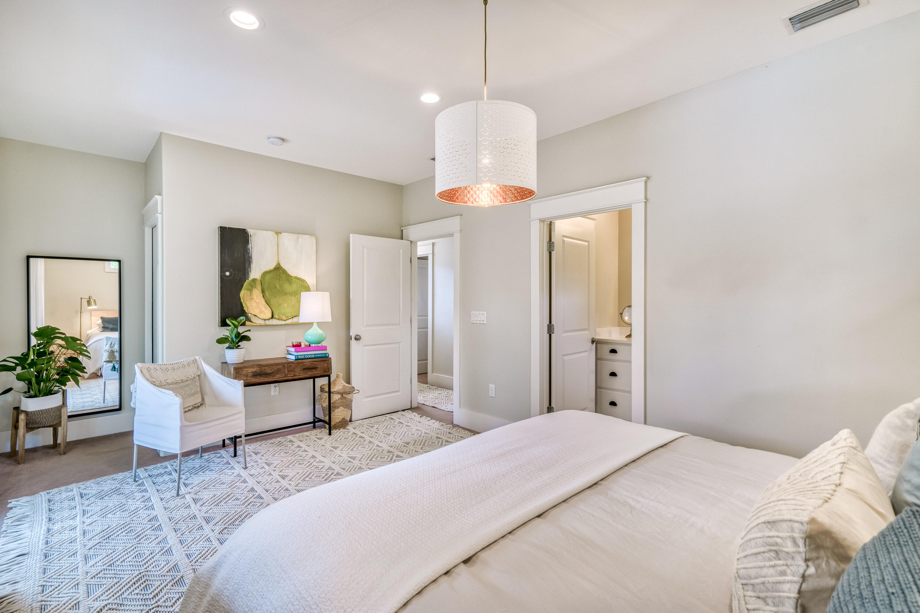 100 Snapper Street Santa Rosa Beach, FL 32459 - Photo 14 of 35 a bedroom with a bed and a chandelier