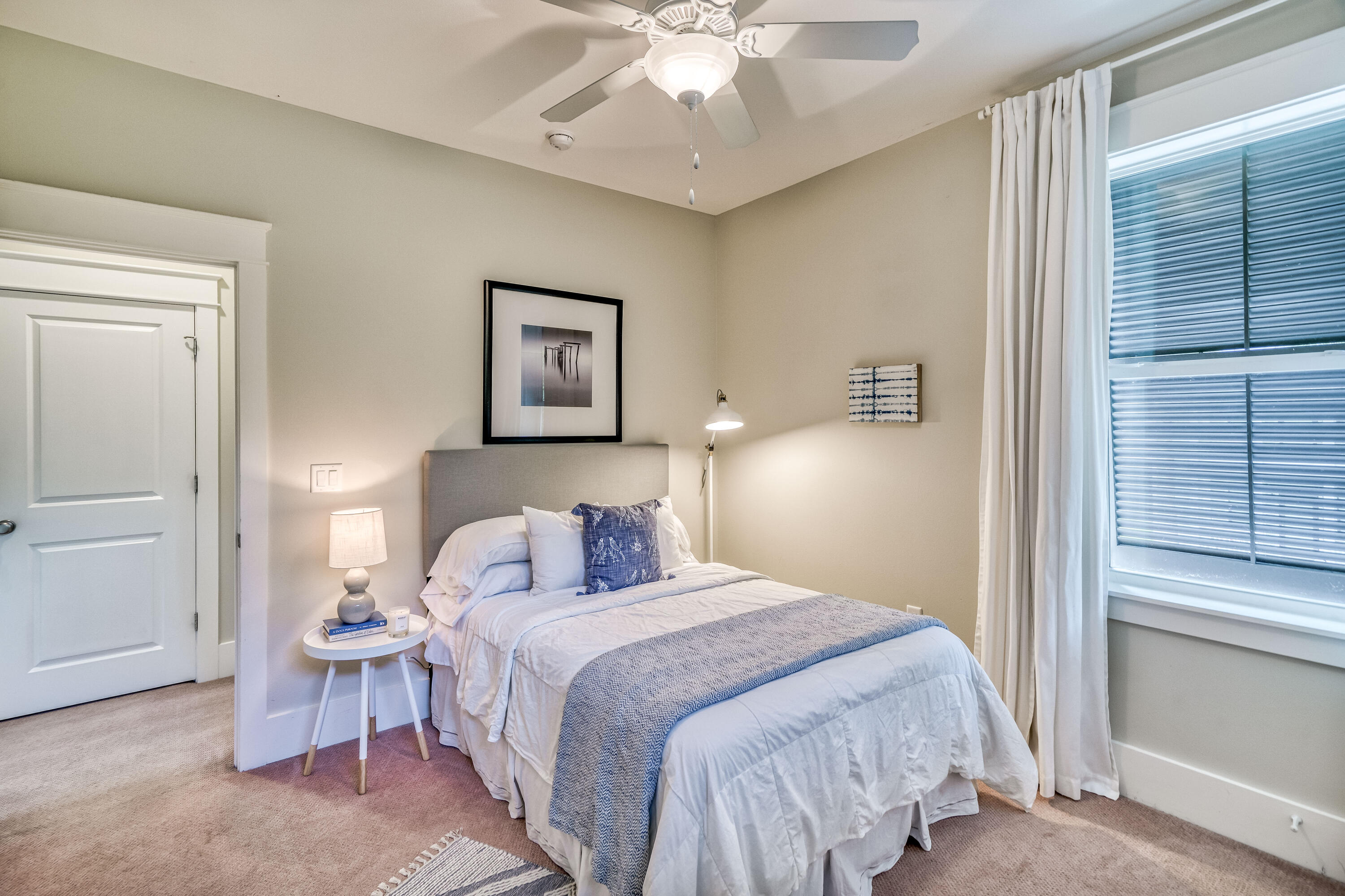 100 Snapper Street Santa Rosa Beach, FL 32459 - Photo 18 of 35 a bedroom with a bed and a chandelier