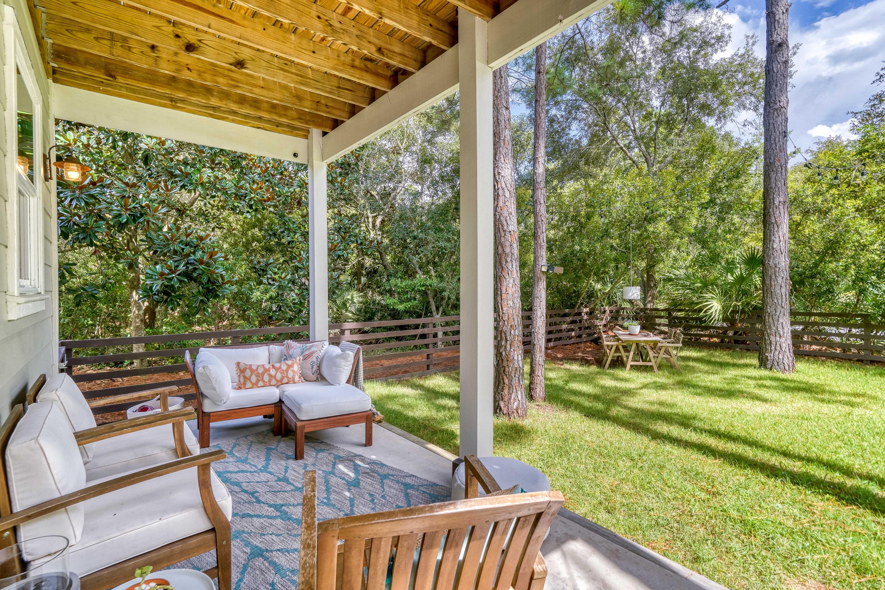 100 Snapper Street Santa Rosa Beach, FL 32459 - Photo 22 of 35 a view of a chair and tables in the patio