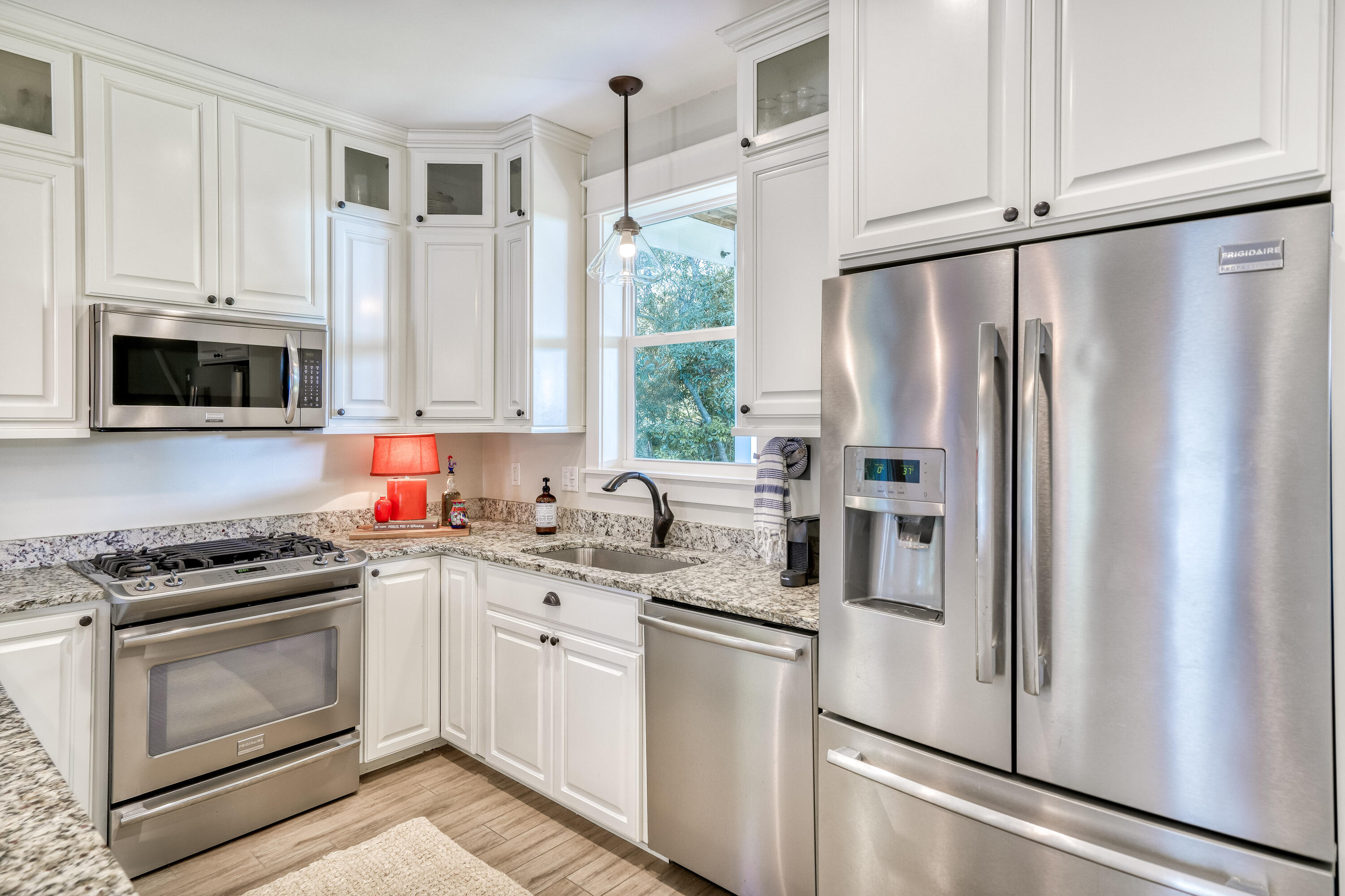 100 Snapper Street Santa Rosa Beach, FL 32459 - Photo 6 of 35 a kitchen with stainless steel appliances a refrigerator sink and microwave