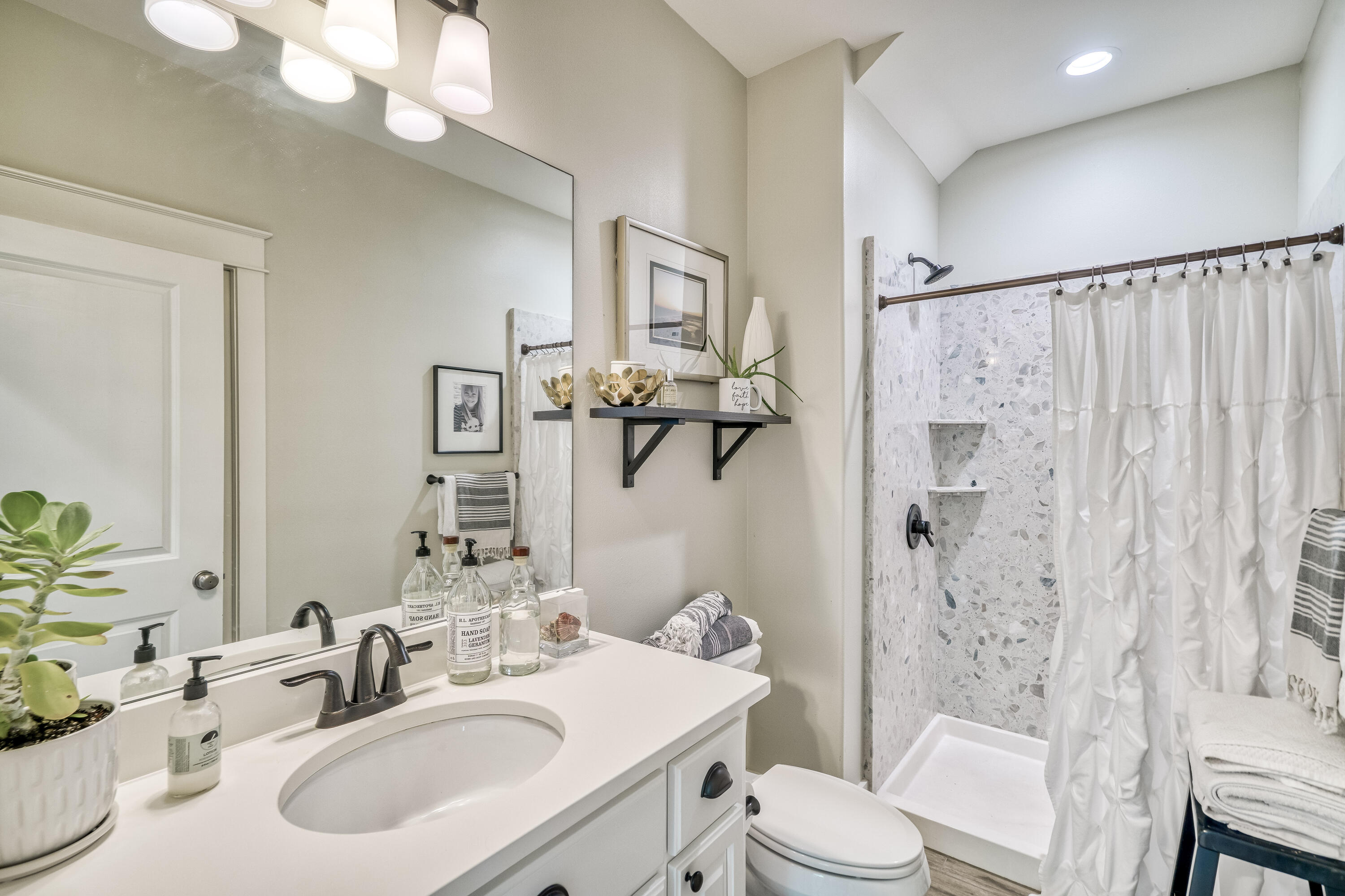 100 Snapper Street Santa Rosa Beach, FL 32459 - Photo 8 of 35 a bathroom with a sink vanity mirror and toilet