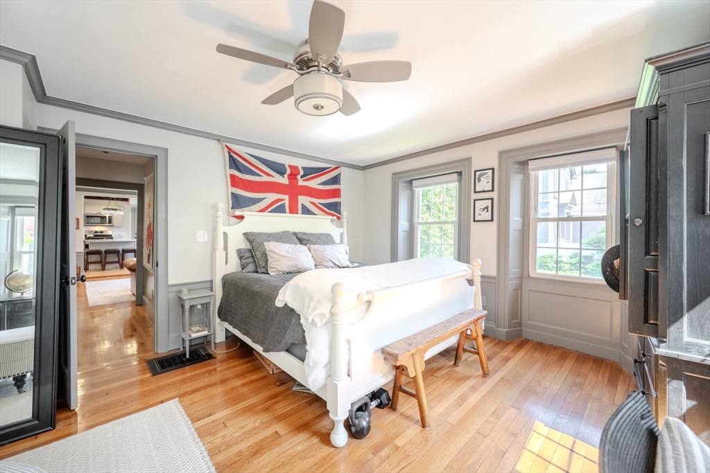 8 Williams Street, Unit E1 Salem, MA 01970 - Photo 13 of 30 a bedroom with a large bed and a chandelier