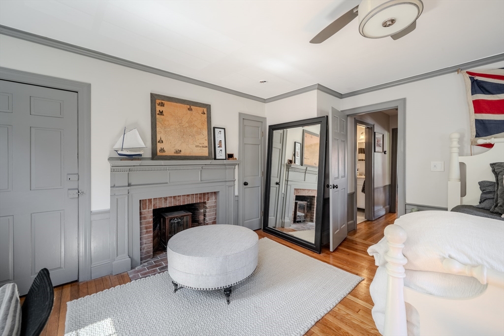 8 Williams Street, Unit E1 Salem, MA 01970 - Photo 14 of 30 a living room with furniture and a fireplace