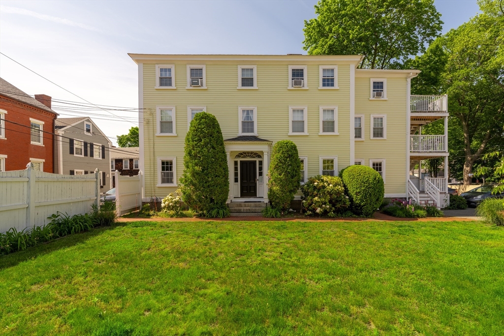 8 Williams Street, Unit E1 Salem, MA 01970 - Photo 20 of 30 a front view of a house with a yard