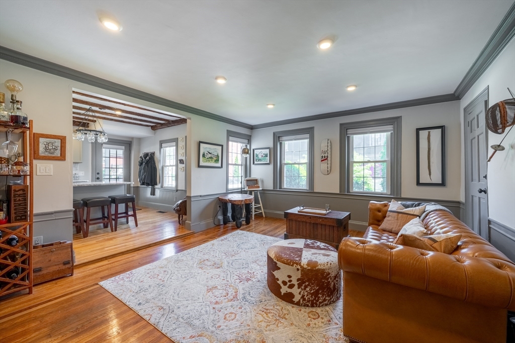 8 Williams Street, Unit E1 Salem, MA 01970 - Photo 2 of 30 a living room with furniture and wooden floor