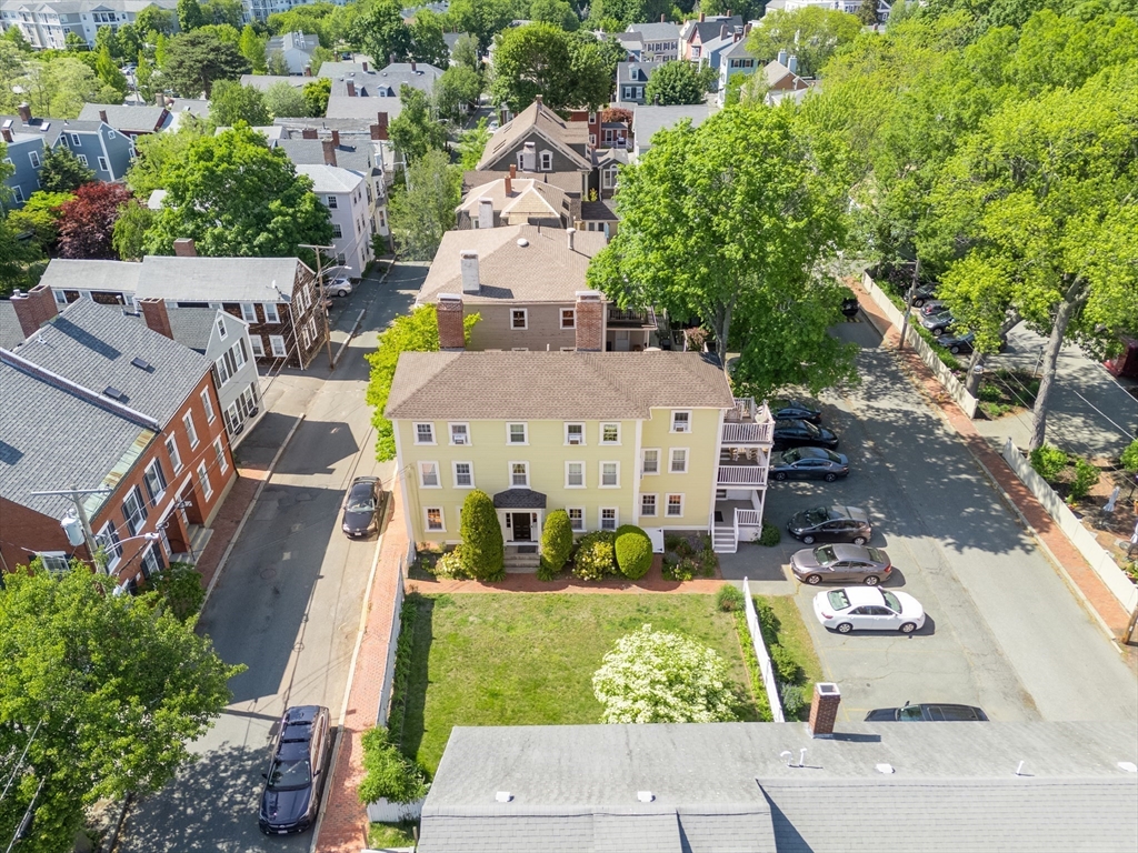 8 Williams Street, Unit E1 Salem, MA 01970 - Photo 22 of 30 an aerial view of multiple houses with yard
