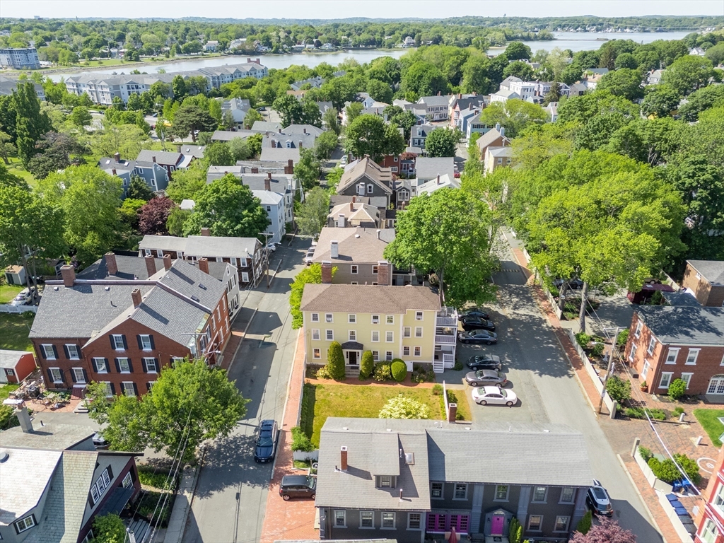 8 Williams Street, Unit E1 Salem, MA 01970 - Photo 24 of 30 an aerial view of a house with a swimming pool yard and outdoor seating
