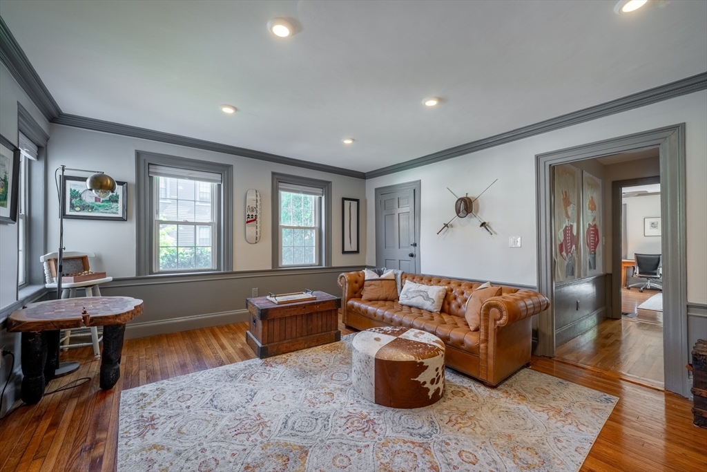 8 Williams Street, Unit E1 Salem, MA 01970 - Photo 3 of 30 a living room with furniture a rug and a window