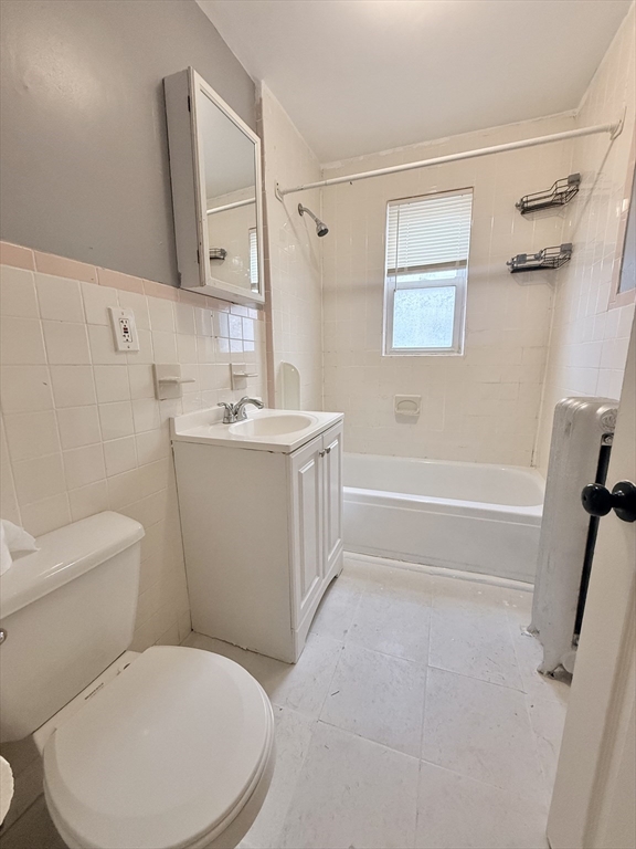 39 Wentworth Street, Unit 3 Boston, MA 02124 - Photo 16 of 19 a bathroom with a toilet sink and mirror