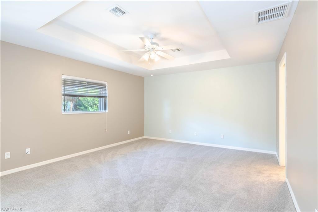11153 San Sebastian Lane Bonita Springs, FL 34135 - Photo 11 of 25 an empty room with a window and a ceiling fan