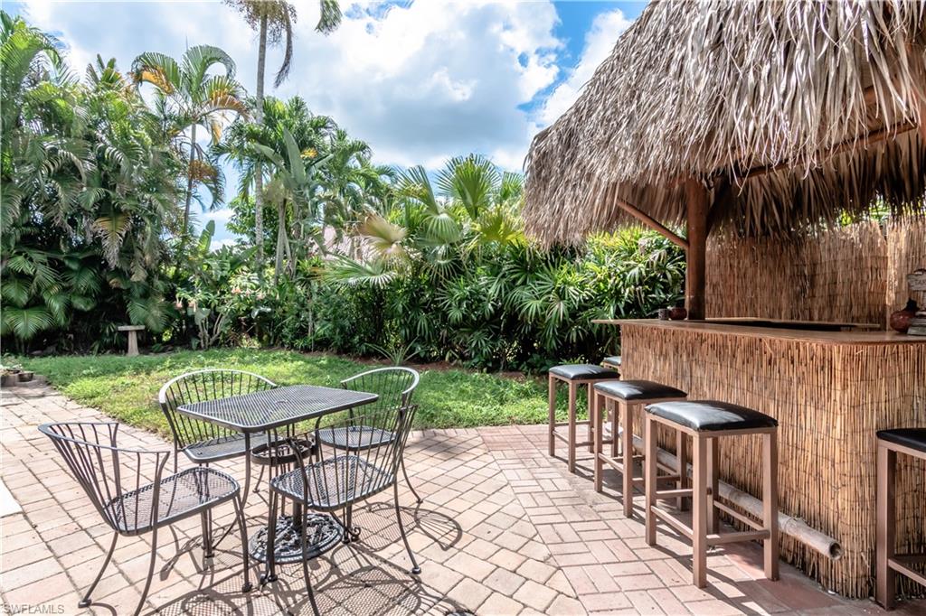 11153 San Sebastian Lane Bonita Springs, FL 34135 - Photo 19 of 25 a view of a backyard with sitting area