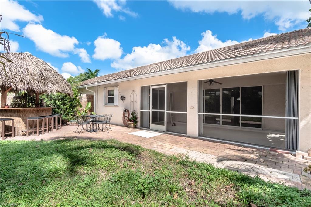11153 San Sebastian Lane Bonita Springs, FL 34135 - Photo 20 of 25 a view of a house with backyard and sitting area