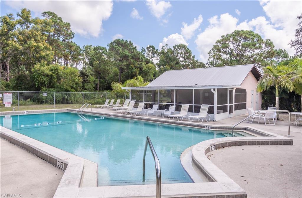 11153 San Sebastian Lane Bonita Springs, FL 34135 - Photo 21 of 25 a view of a swimming pool with chairs