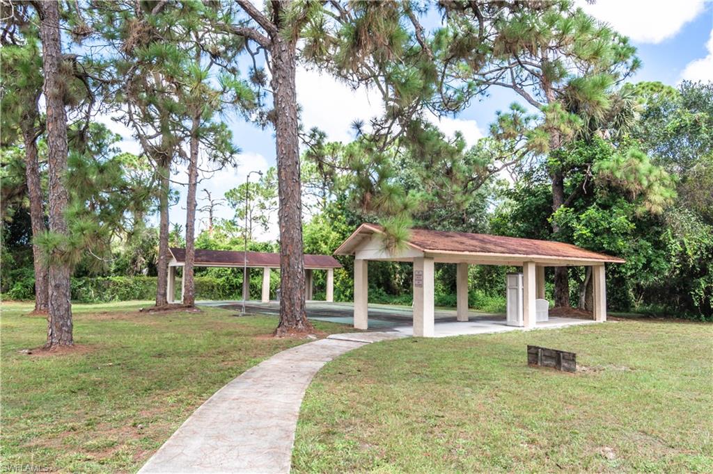11153 San Sebastian Lane Bonita Springs, FL 34135 - Photo 22 of 25 front view of a house with a yard