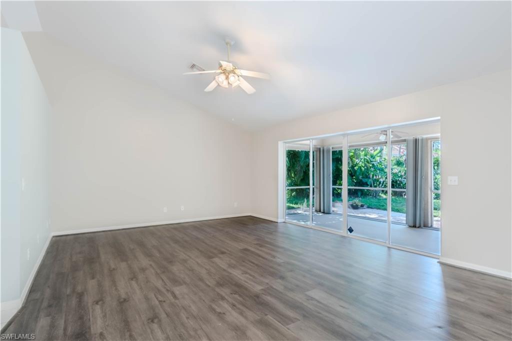 11153 San Sebastian Lane Bonita Springs, FL 34135 - Photo 3 of 25 a view of an empty room with wooden floor and a window