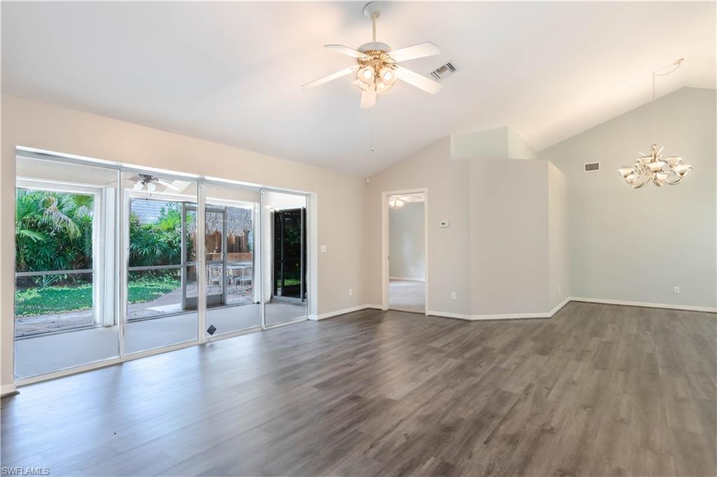 11153 San Sebastian Lane Bonita Springs, FL 34135 - Photo 4 of 25 a view of an empty room with a window and wooden floor
