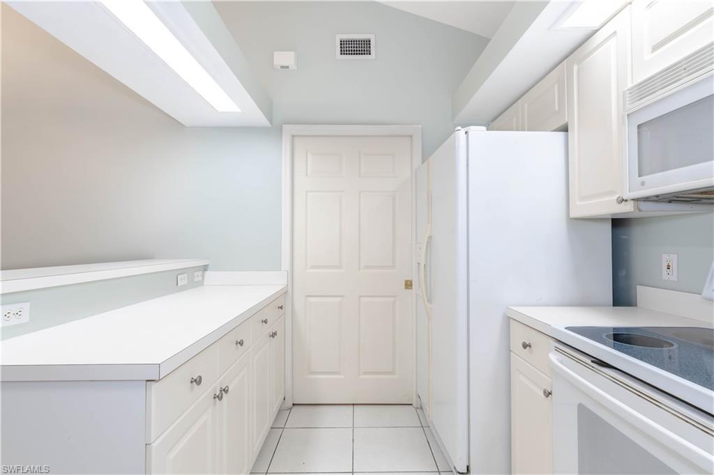 11153 San Sebastian Lane Bonita Springs, FL 34135 - Photo 9 of 25 a kitchen with a sink and cabinets