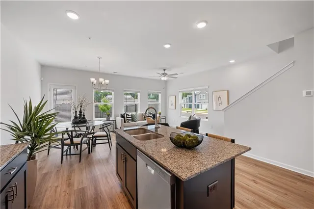 a kitchen with counter space and wooden floor