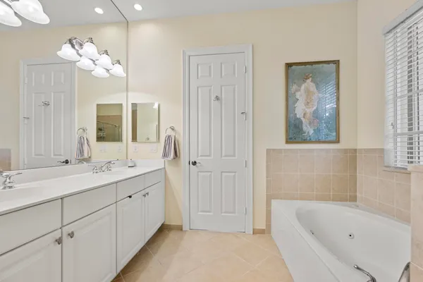 a bedroom with a bed and a lamp