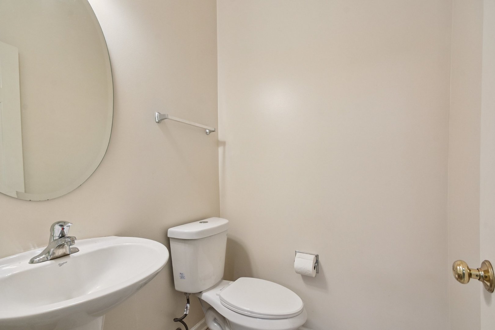 2486 Georgetown Circle Aurora, IL 60503 - Photo 11 of 26 a white toilet sitting next to a white sink
