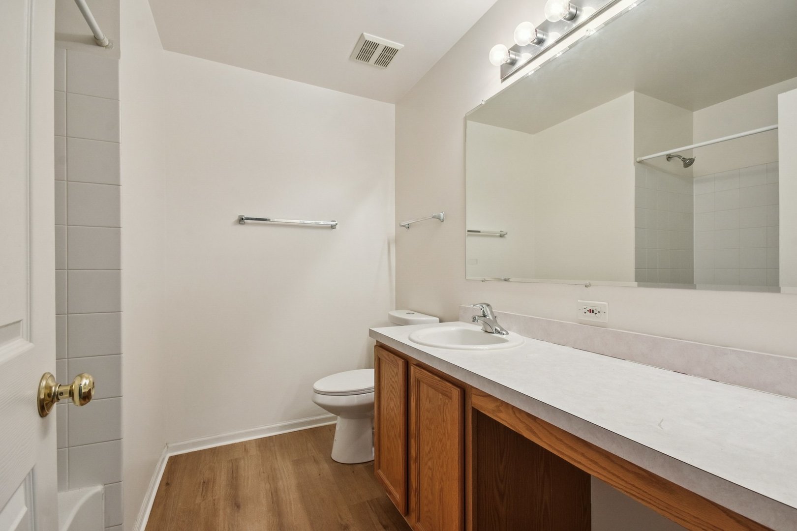 2486 Georgetown Circle Aurora, IL 60503 - Photo 12 of 26 a bathroom with a sink and a mirror