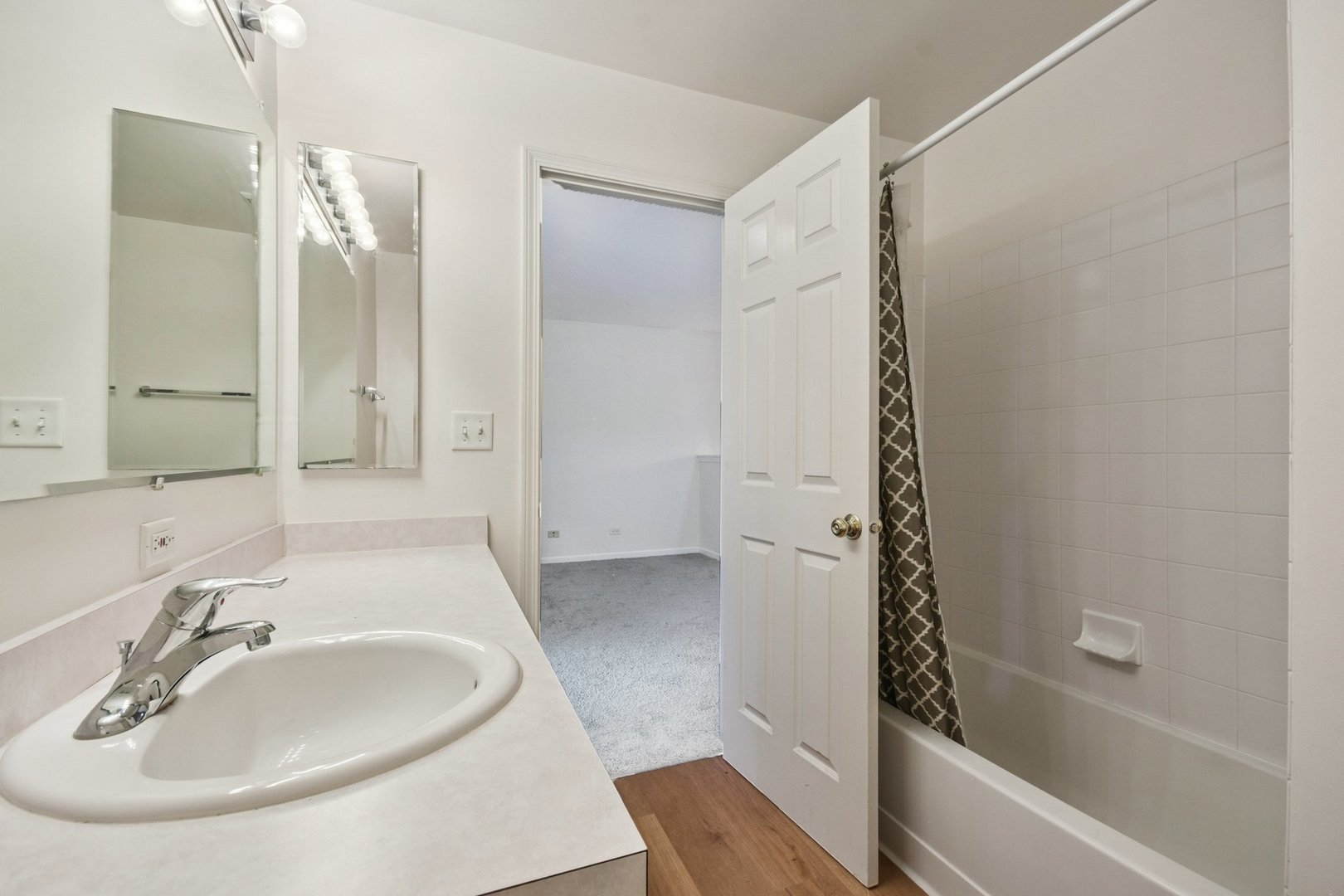 2486 Georgetown Circle Aurora, IL 60503 - Photo 13 of 26 a bathroom with a sink a toilet and shower