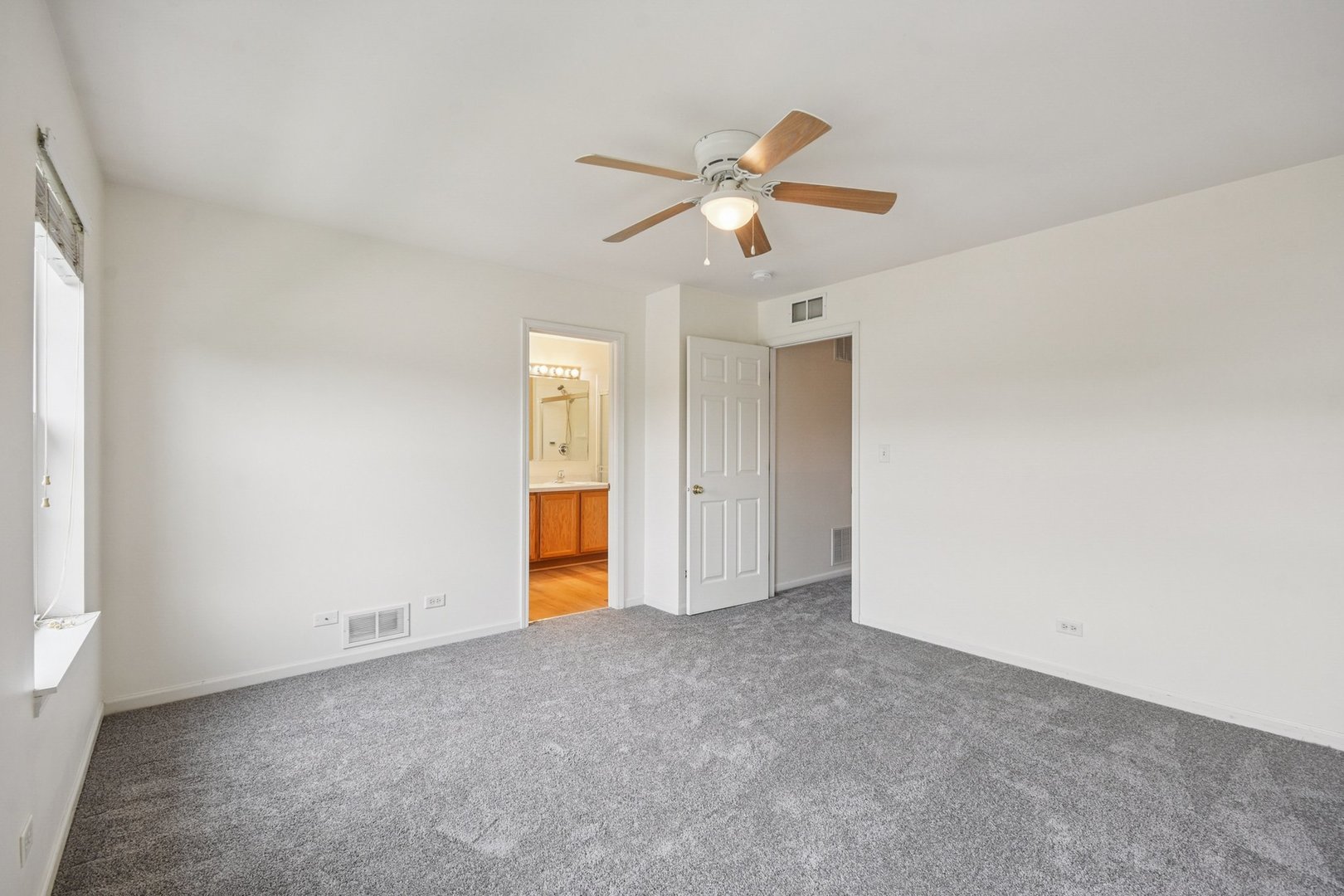 2486 Georgetown Circle Aurora, IL 60503 - Photo 21 of 26 a view of an empty room with a fan