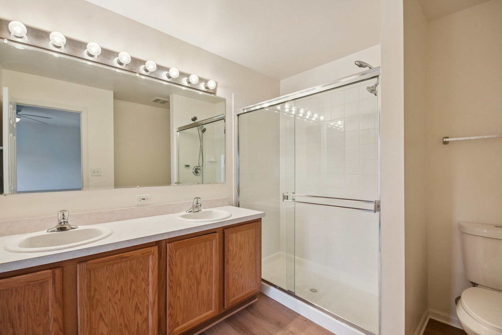 2486 Georgetown Circle Aurora, IL 60503 - Photo 23 of 26 a bathroom with a double vanity sink mirror and toilet
