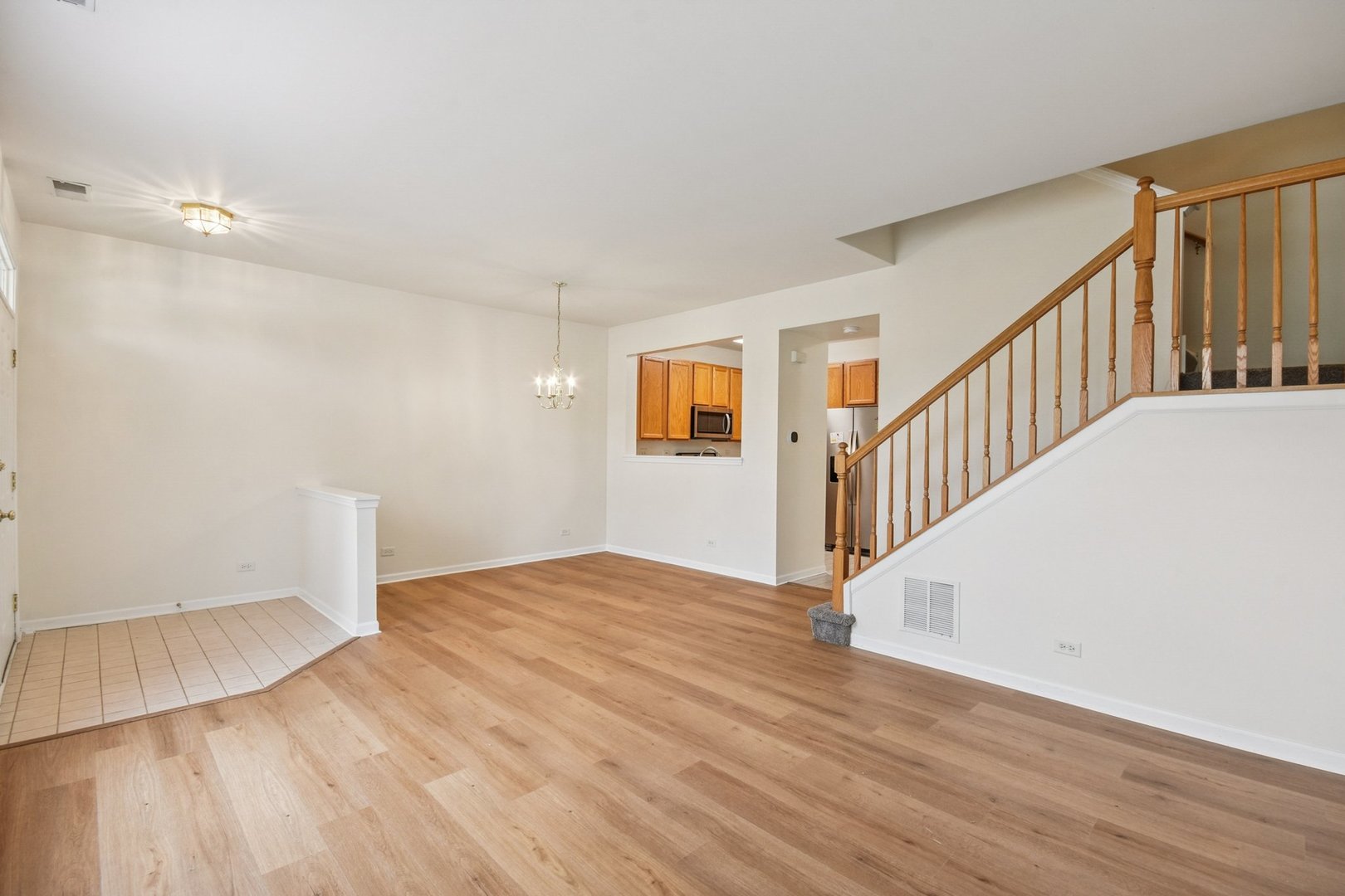 2486 Georgetown Circle Aurora, IL 60503 - Photo 5 of 26 a view of empty room with wooden floor