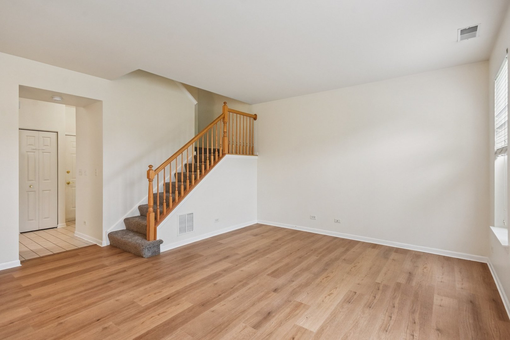 2486 Georgetown Circle Aurora, IL 60503 - Photo 6 of 26 a view of entryway with wooden floor