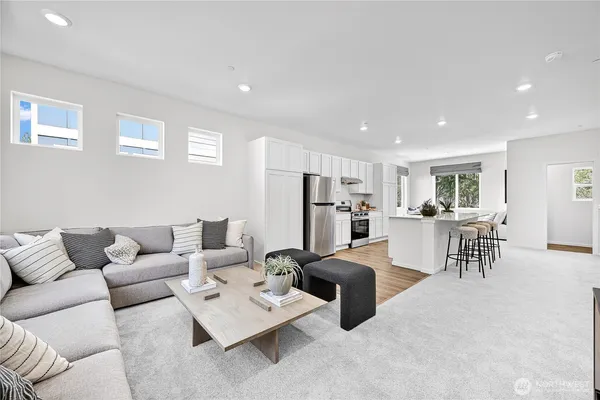 a living room with furniture and a table